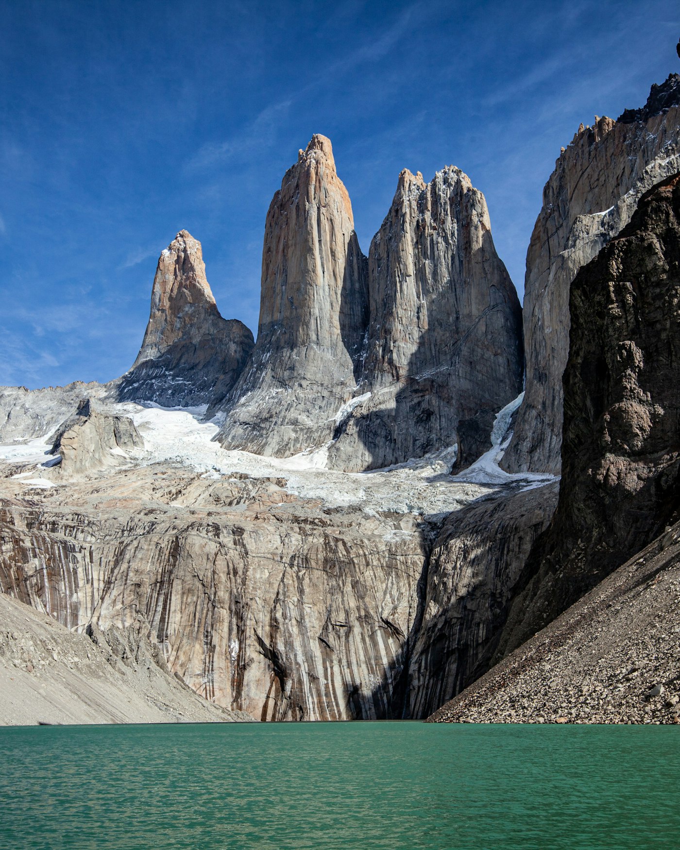 Turquoise water below the granite peaks of Torres del Paine, Chile